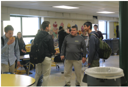 Two seniors distract Mr. Robertson while their friend sneaks away with the prize