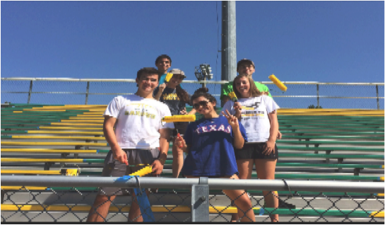 Kaitlin Bonacci and other school leaders on the bleachers. They help out our school every day.