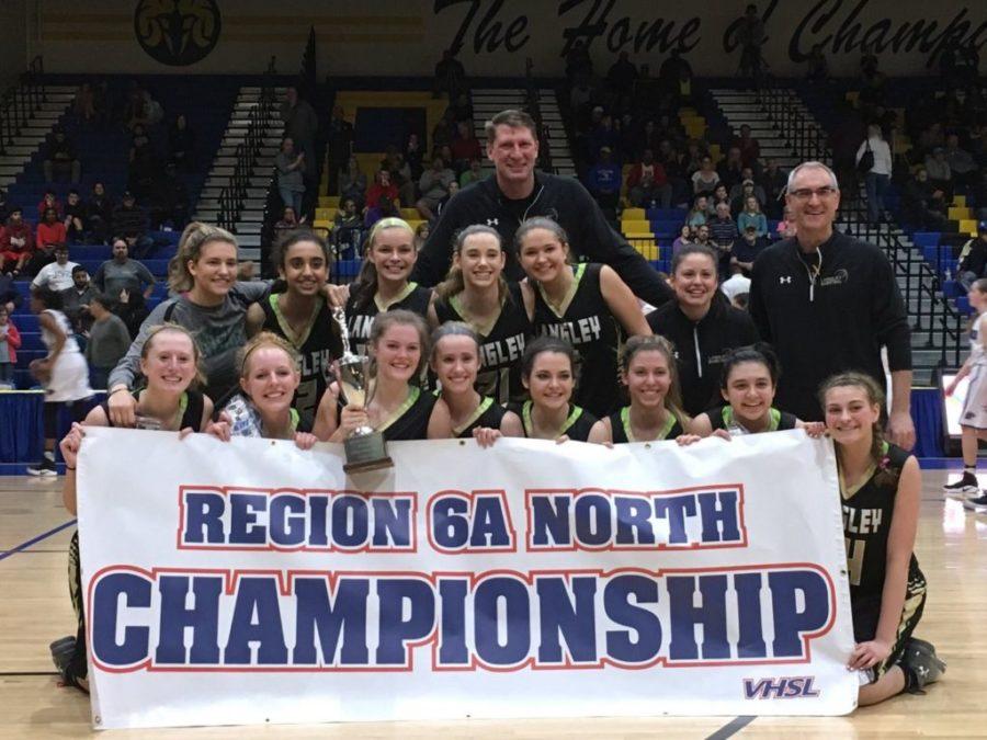 Pictured is the girls basketball team with the coaches on the right holding the regional championship banner. They will play the first round of the state championship on March 3rd