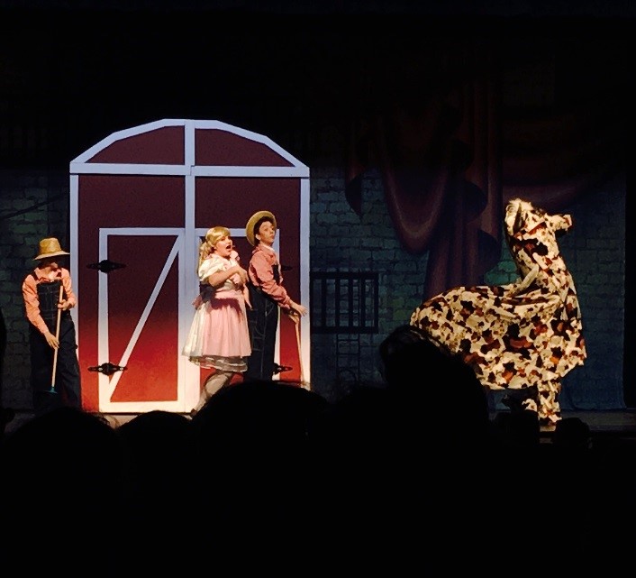 Singing and dancing, Saxon Stage actors Sydney Copp and Cuinn Casey sing and dance on the stage. In order to prepare the show, students spent countless hours rehearsing all of their songs and dances to perfection