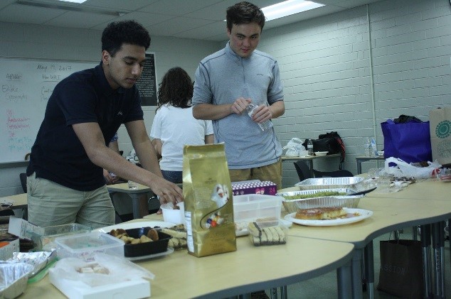 Mr. Jackson’s AP Human Geography class parties after their grueling AP exam, celebrating with desserts from around the world