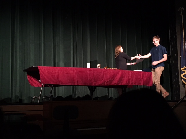 Students accept their awards at the annual award ceremony