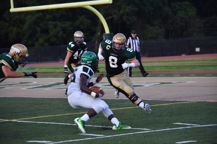 Football team captain Bennett Norris makes a tackle against South Lakes