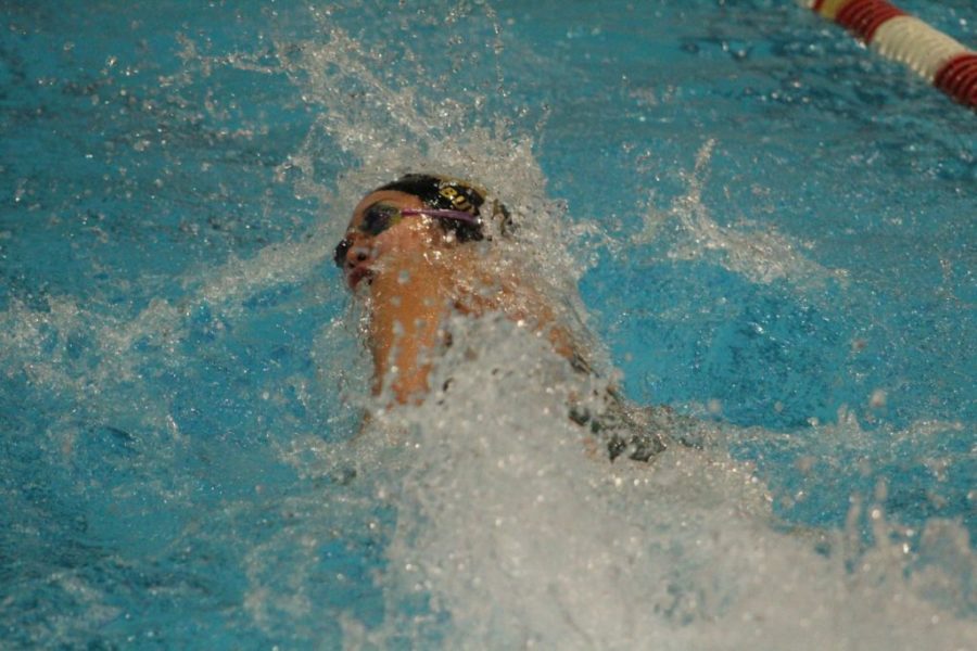 Senior and Girls Swim Captain, Julia Bullock, making strides in 100 freestyle.