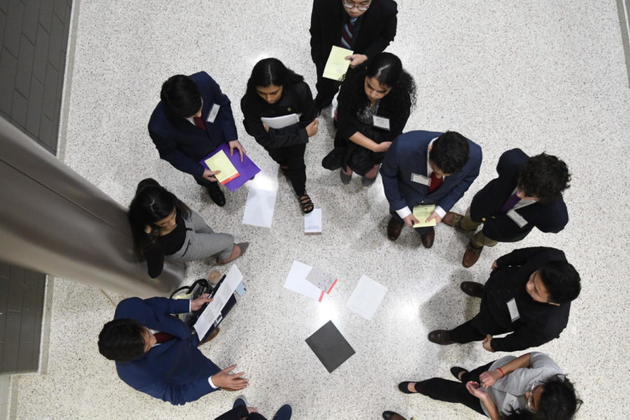 Delegates assembled in Langley Hall for an unmoderated caucus discussing world issues. 