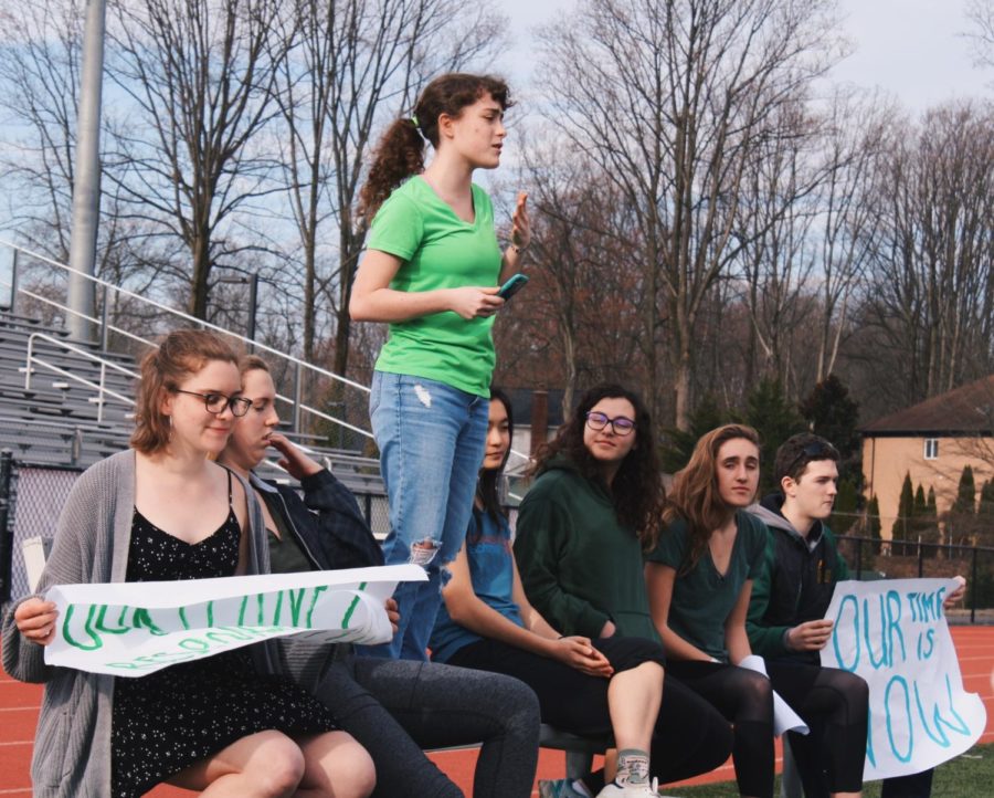 The organizers of the Climate Strike (from left to right: Lindsay Nyquist, Lizzy Gersony, Reece Herbery, Katherine Sano,Eliza Siegel, Anna Spear, and Connor Graves) gathered up in front of the crowd of strikers making call-to-action speeches.