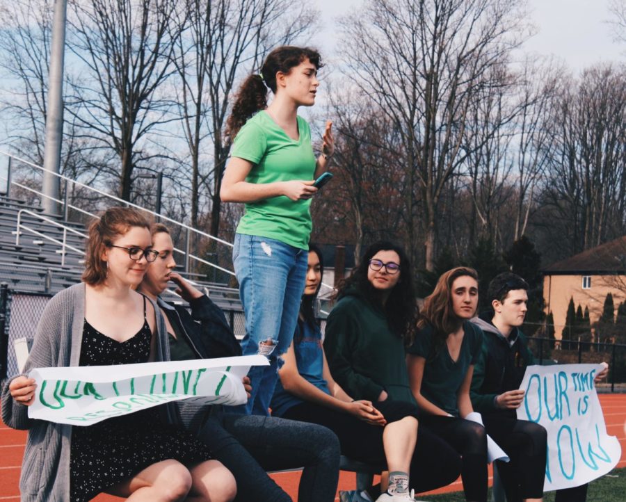The organizers of the Climate Strike (from left to right: Lindsay Nyquist, Lizzy Gersony, Reece Herbery, Katherine Sano,Eliza Siegel, Anna Spear, and Connor Graves) gathered up in front of the crowd of strikers making call-to-action speeches.