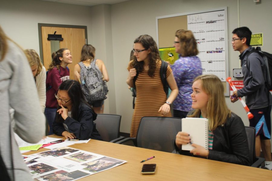 Club leaders gather at an after-school meeting to discuss upcoming plans (Photo by Nathalie Hoffman).