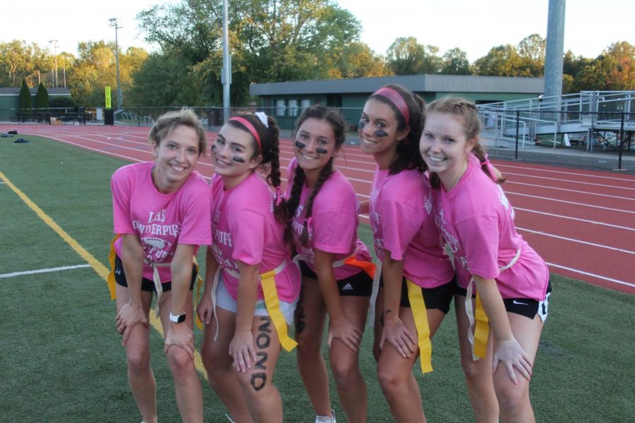With seniors sporting pink and juniors decked in white, the annual Powder Puff game was a vivid event (Photo by Annabeth Holsinger).