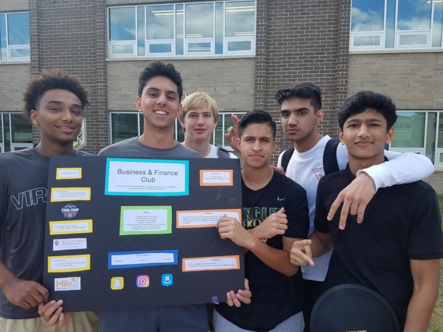 Members of the Finance Club display their tri-fold board at Club Day (Photo by David Song).