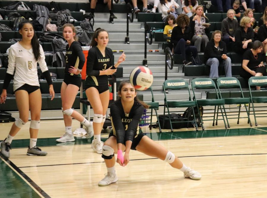 Sabrina+Duque-Lewis+crouches+to+pass+the+ball+to+her+teammates+during+a+match+%28Photos+by+Yousuf+Mufti%29.