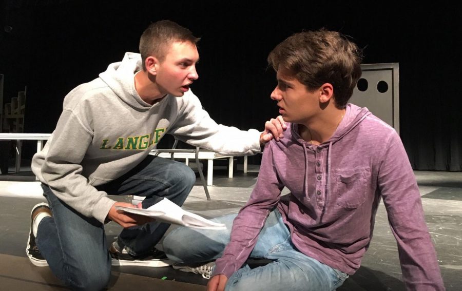 Senior Peter Fox and junior Cole Sitilides perform lines during the winter production of Romeo and Juliet. The political twist on an old Shakespearean classic produced commentary on the current climate of policy many Saxons related to (Photo by Shakeel).