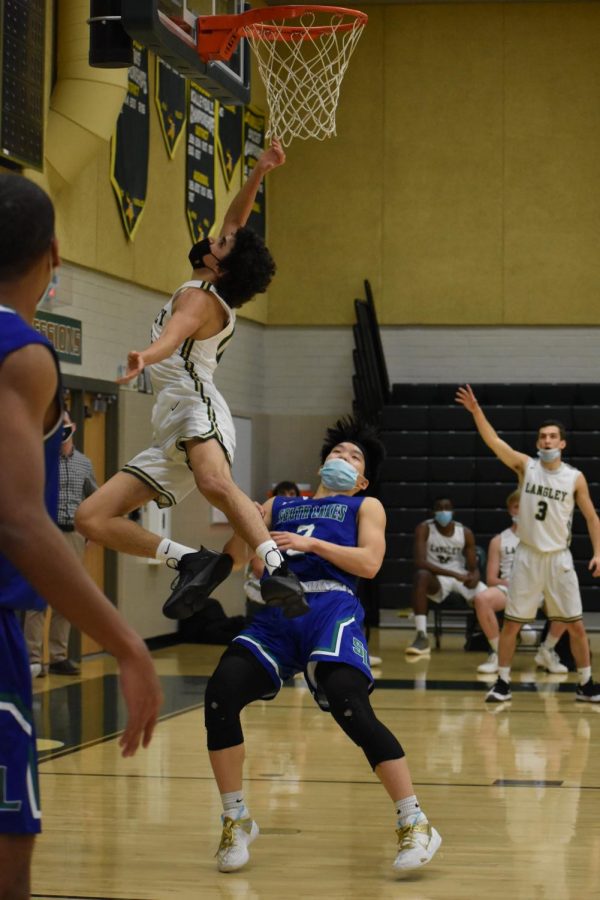 Junior Amr Areikat goes for the layup during the 4th quarter. Even though the Saxons fought hard, South Lakes ended the game six points ahead. 