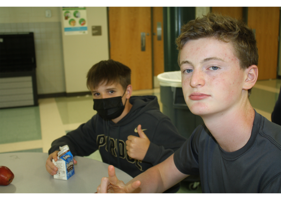 Freshmen Cole Jensen and Hunter Zipperer eat free school lunch in the cafeteria. Free lunch is offered at school everyday.
