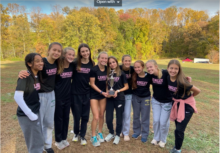 The+team+poses+alongside+their+second+place+trophy+from+the+Regional+cross+country+meet+at+Burke+Lake.+Each+runner+played+a+key+role+in+getting+the+trophy+as+they+ousted+Oakton+by+only+4+spots.+