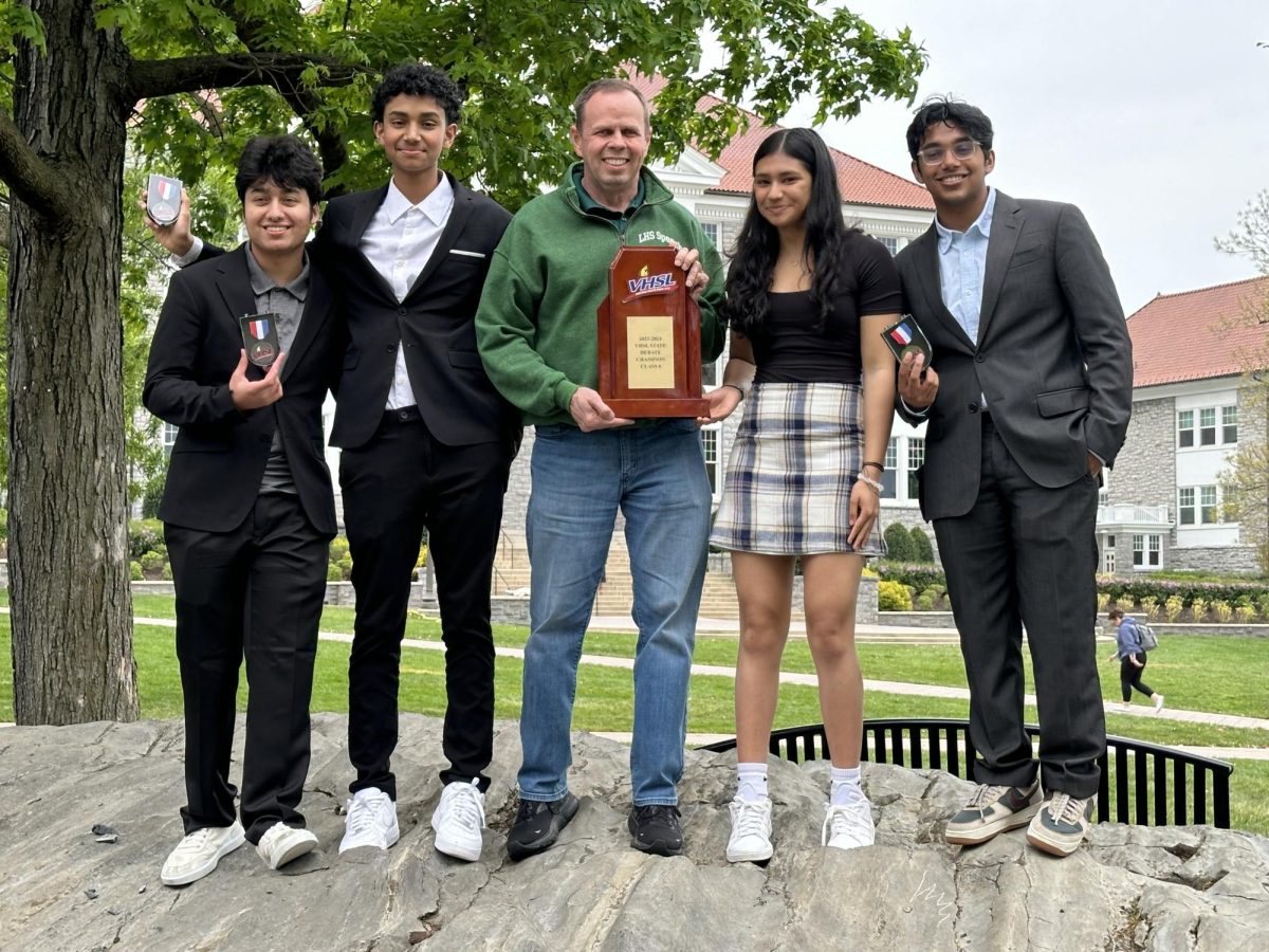 Shah (from left), Gubbi, Krivak, De, and Rakasi stand on the James Madison University campus after the VHSL state championship. Langley won first place at the championship.